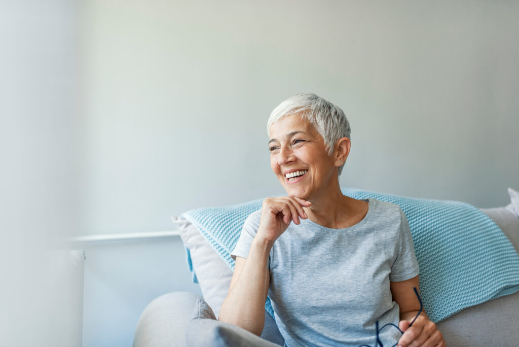 Happy woman relaxing on her couch