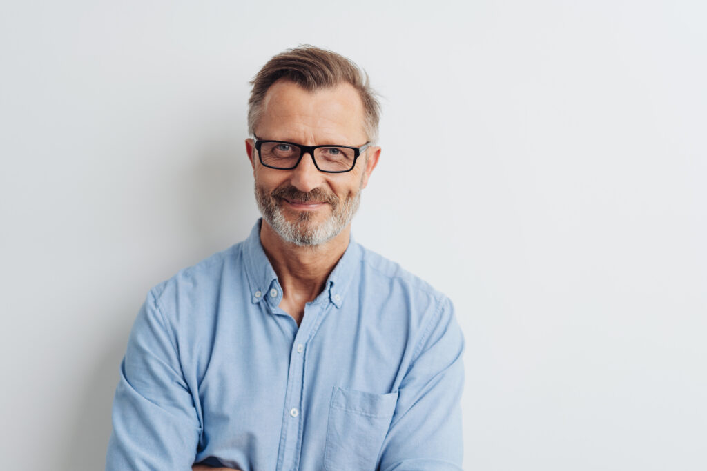 middle-aged man wearing glasses white background