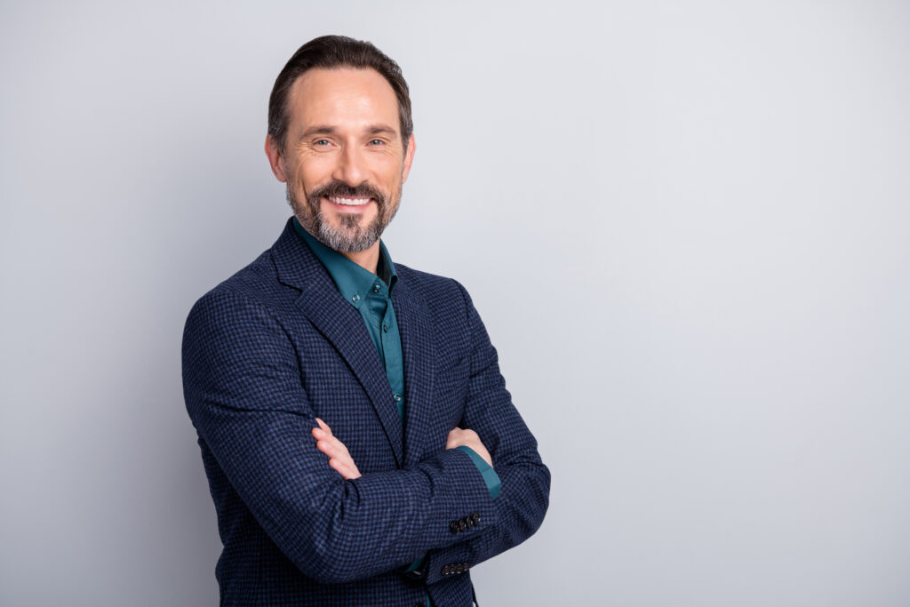 Sideview of smiling middle aged man smiling