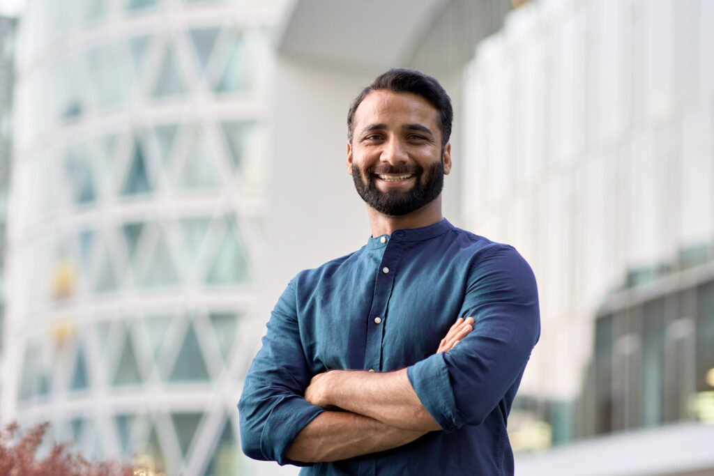 Smiling man arms crossed