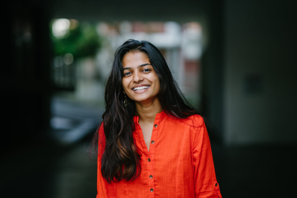 Smiling woman in red blouse