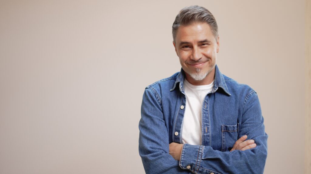 Casual man smiling with mouth closed