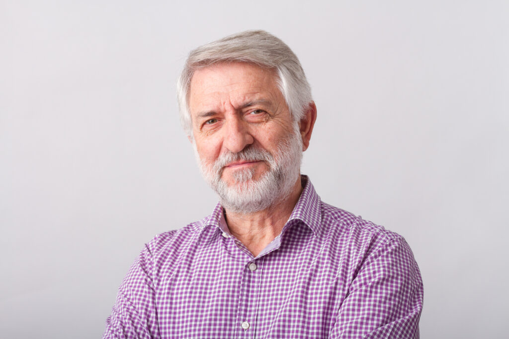 man in pink shirt on white background