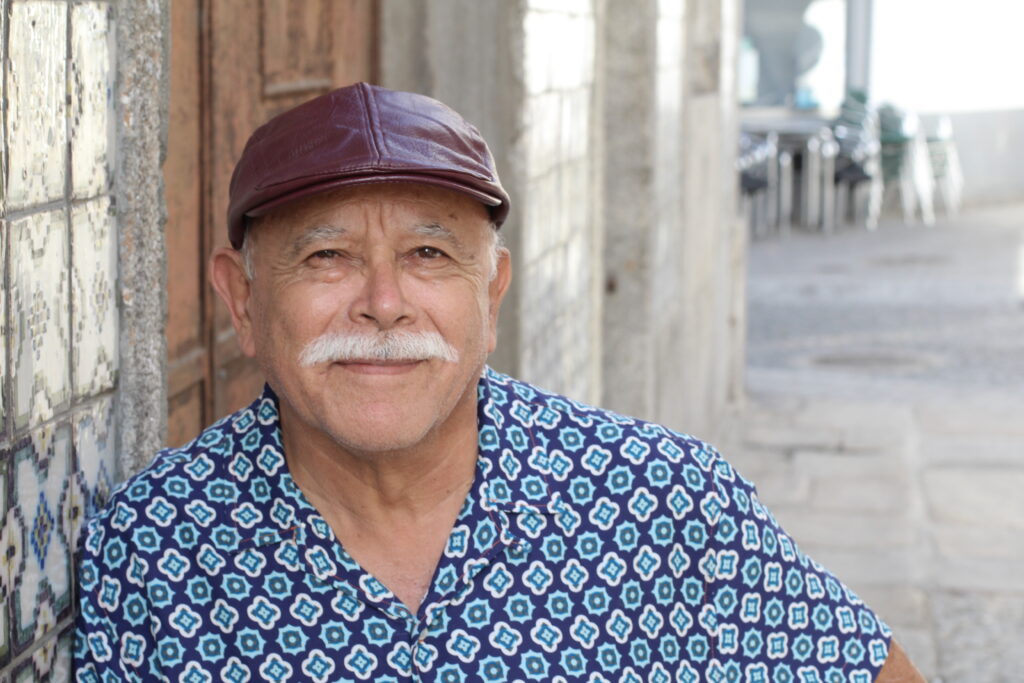 Senior Hispanic Man Standing Outside