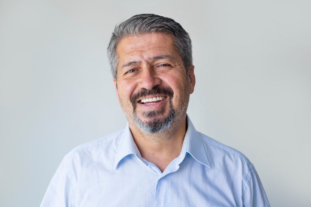 Smiling man on grey background