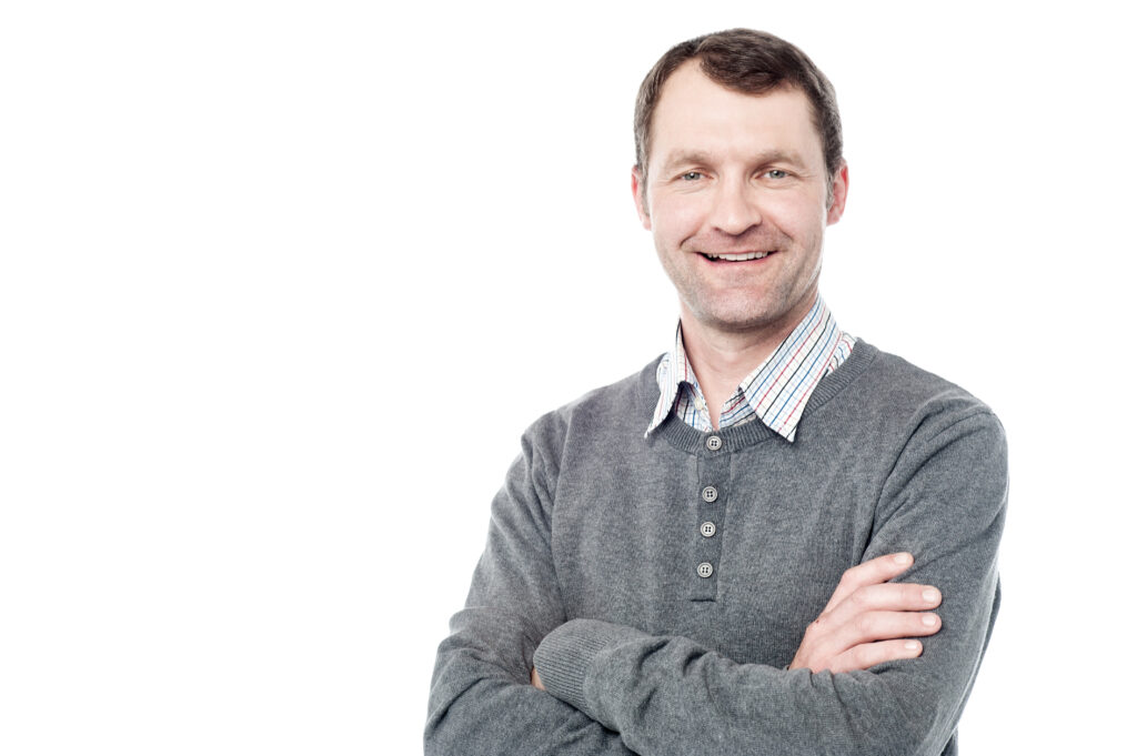 Confident caucasian man posing with folded arms