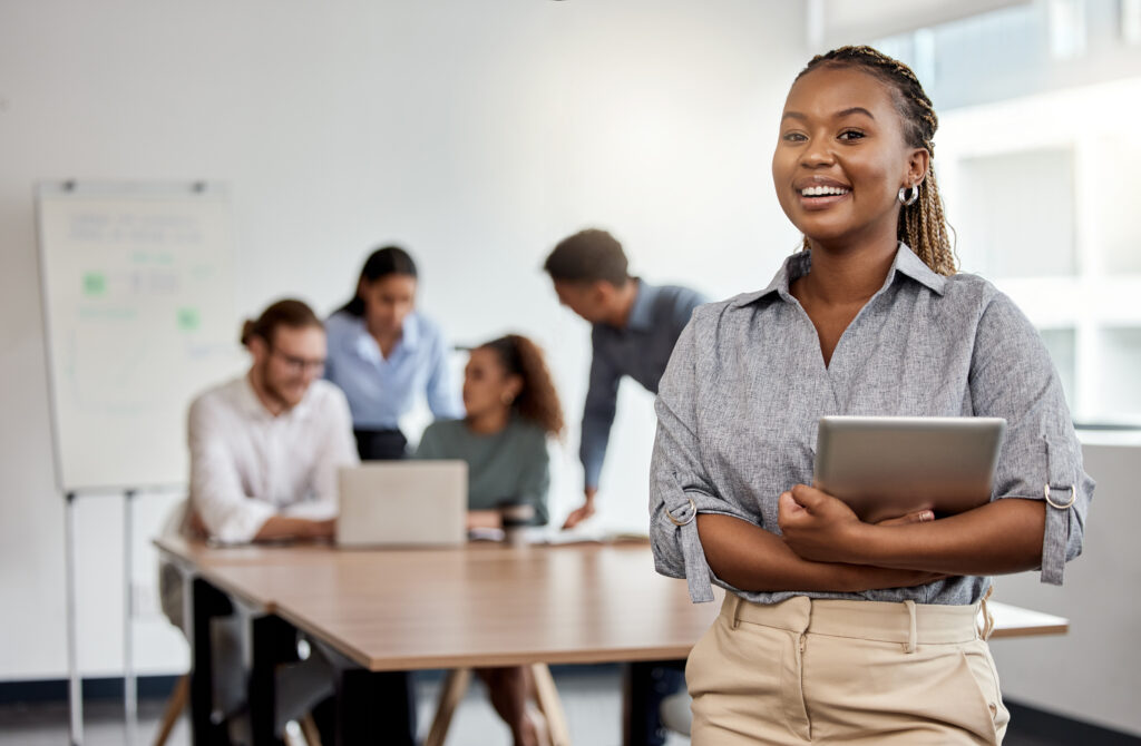 Smile, boardroom and portrait of a black woman with a tablet for training, meeting or teamwork. Happy, business and a corporate employee with technology in a work office for company planning.