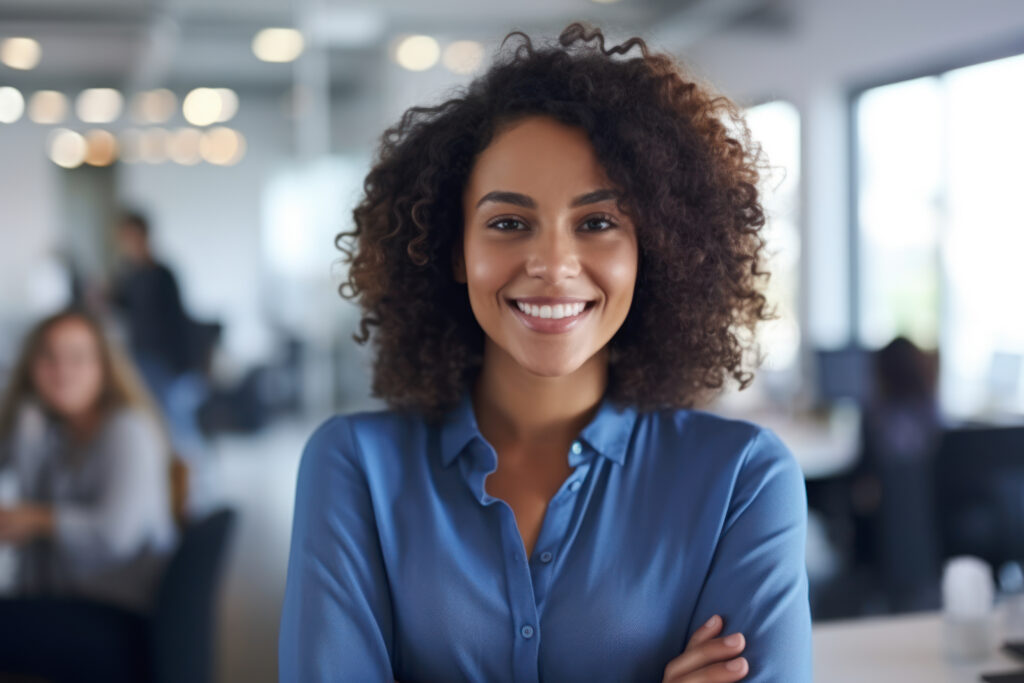 Young african american woman standing in an office with her arms crossed and looking at the camera. Generative AI